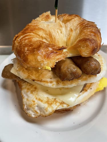 sausage egg and cheese on a croissant