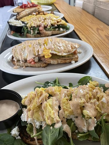 row of fresh breakfast items avocado toast